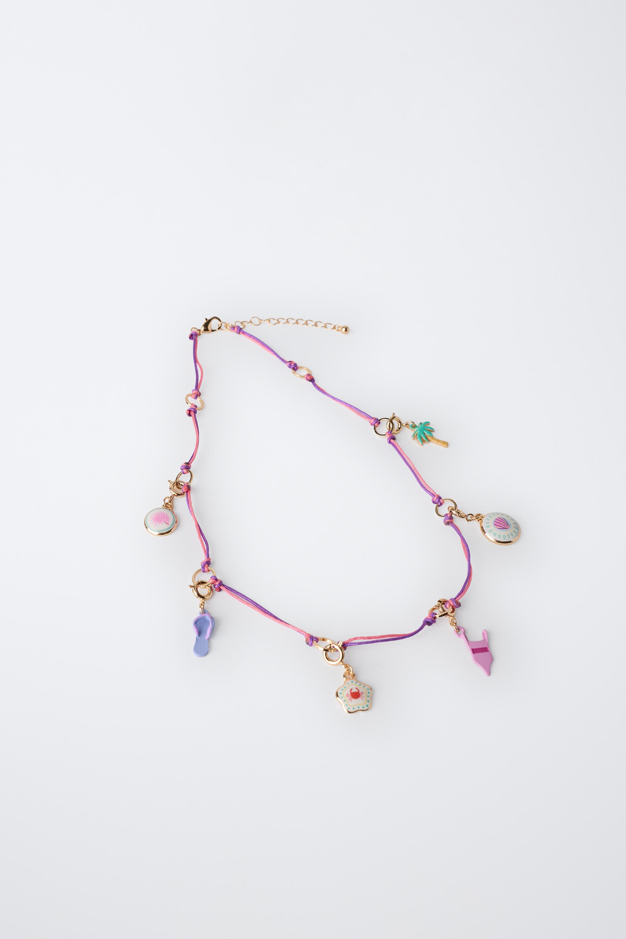 INTERCHANGEABLE MULTI-CHARM NECKLACE